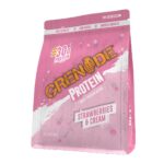 Grenade Protein Strawberries & Cream whey protein pouch with 30g protein displayed on a pink background with a scoop of protein powder.